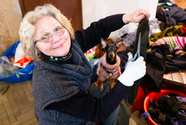 Ukrainian woman refugee with her small dog